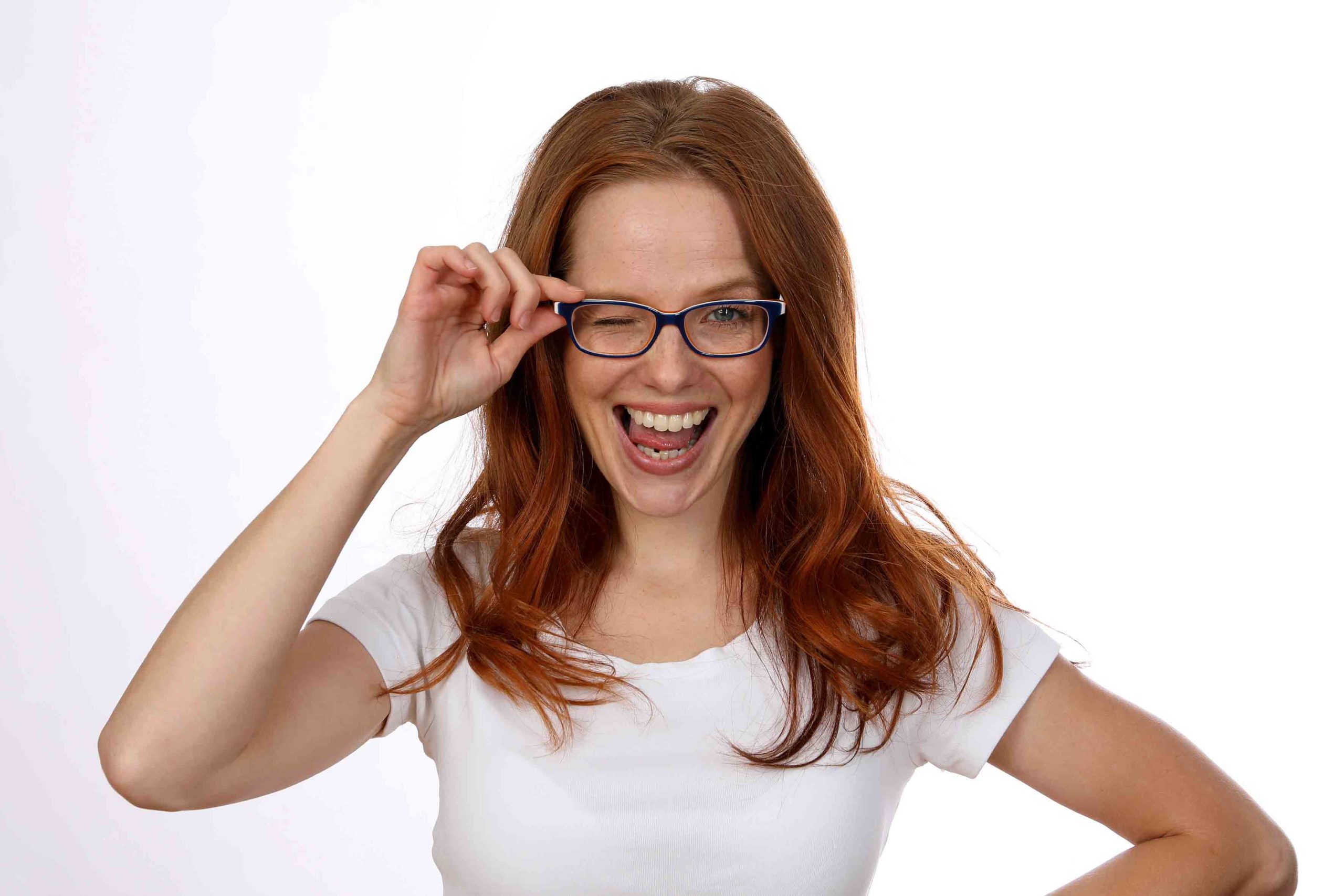 Beautiful redhead woman with glasses
